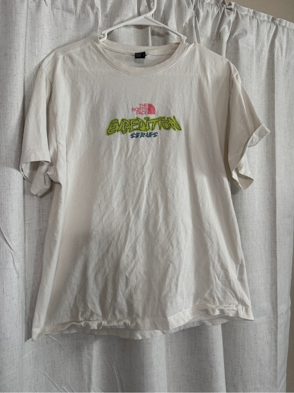 The North Face Cream Short Sleeve Tee with Neon Expedition Graphic